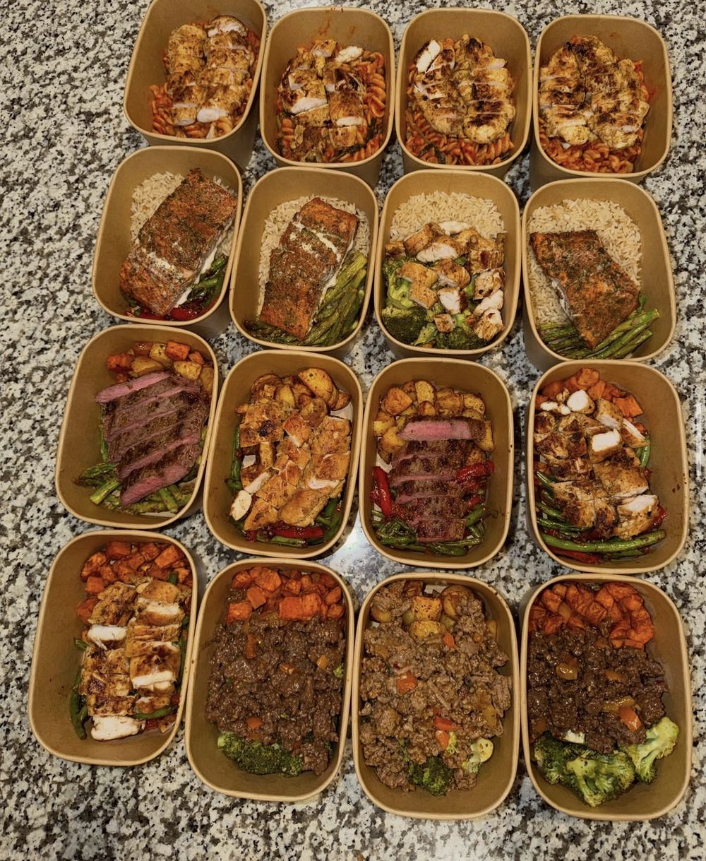 Sixteen packed meals with chicken pasta, salmon, steak, chicken and ground beef bowls
