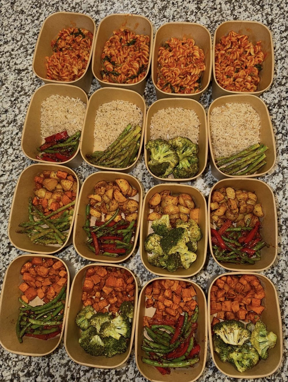 Sides being packed: pasta, rice, potatoes, sweet potatoes, broccoli, green beans and asparagus